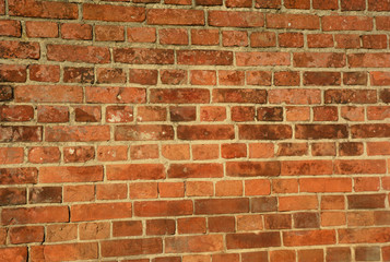 Fototapeta premium Vintage red brick wall. Brick wall retro textured background surface
