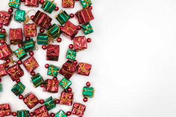 christmas gift boxes with gifts. The decoration is made of small gift boxes. Christmas decoration on a white background. Place for text or picture.