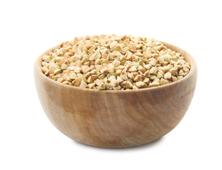 Uncooked green buckwheat grains in bowl isolated on white