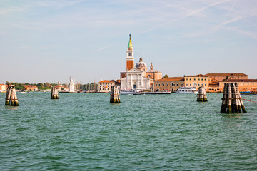 Fototapeta na wymiar Bell tower and church of Saint George also called San Giorgio Maggiore in Venice, Italy