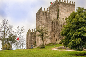 Fototapeta na wymiar Guimaraes - Portugal, Castle, streets, gardens and D. Afonso Henriques statue
