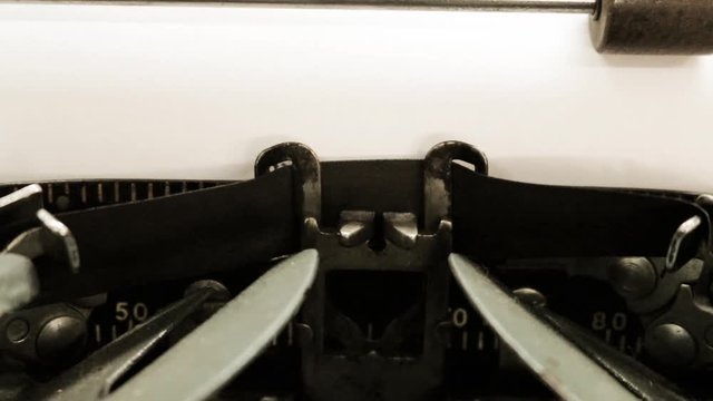Close-up. typing the old metal typewriter, retro style