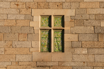 Old window with coloured stained glass wallpaper