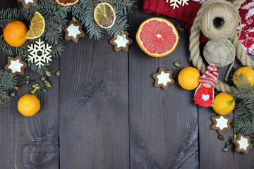 Obraz na płótnie Canvas Christmas tree toys, lemon, orange on a wooden table