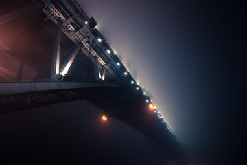 Sydney Harbour bridge cover with fog in night time.