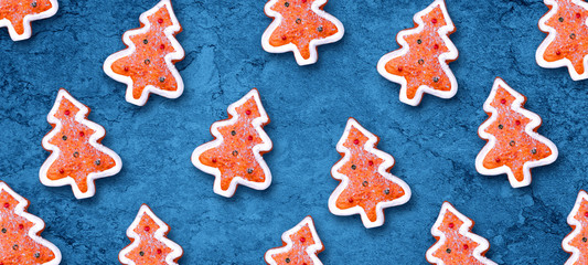Fototapeta na wymiar Christmas gingerbread cookies on a blue background. Christmas background. F