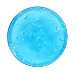 Light blue slime with glitter in plastic container isolated on white, top view. Antistress toy