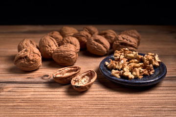 group of tasty nuts next to a bowl