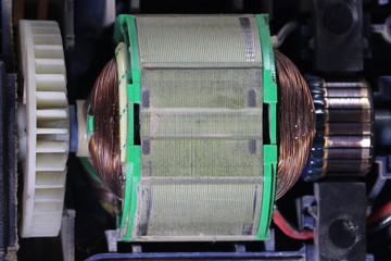 Electric motor with carbon brushes and commutator. Electric machine inside.