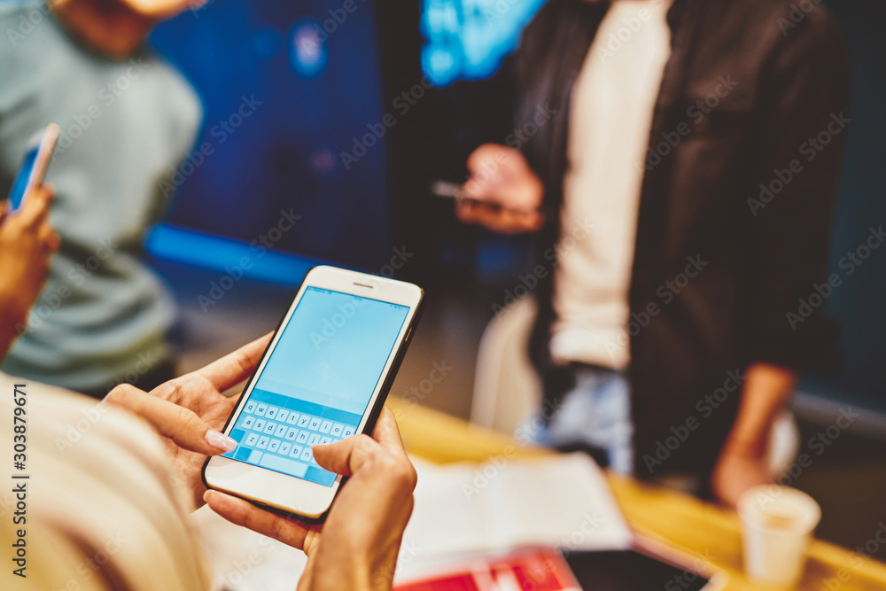 Poster cropped image of female holding mobile phone with blank monitor sending text message via new applica
