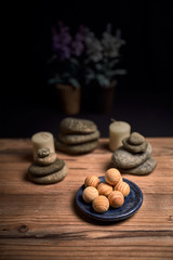 composition of candles, stones and wooden spa balls