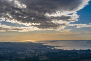 beautiful top view of the city near the ocean at sunset