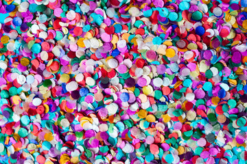 Fototapeta na wymiar Multi-colored paper confetti Card, frame background close-up. Bright colorful festive decor Flat lay