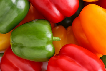 Fresh ripe colorful bell peppers as background, closeup