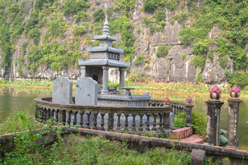 Fototapeta na wymiar Ancient tomb in a pond of Bich Dong. Ninh Binh, Vietnam