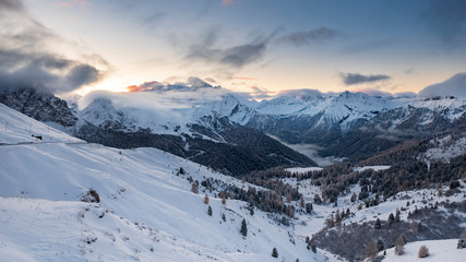 Sunrise over snow covered Alps in South Tyrol, Italy - Deep snow and blue sky