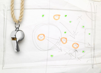 whistle of a soccer / football referee or trainer, with match tactics scribble