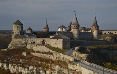 view of Kamianets-Podilskyi Castle at sunset