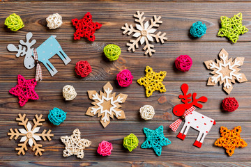 Top view of Christmas toys on wooden background. New Year ornament. Holiday concept