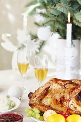 turkey for Christmas. New Year's and Christmas table with turkey in white tones.