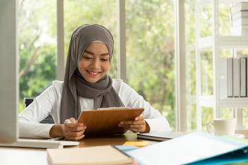 Arabic businesswoman wearing hijab Work in the office