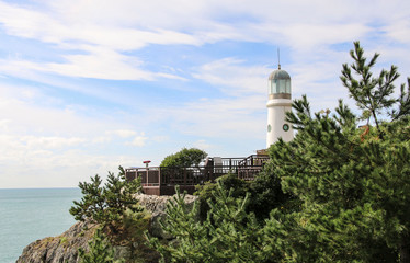 Fototapeta na wymiar Lighthouse at Haeundae Dongbaekseom Island, Busan, South Korea.
