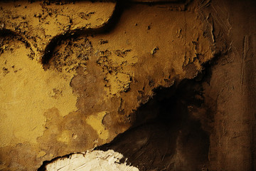 Old peeled plaster dirty dark brown wall