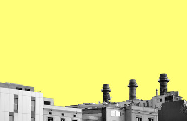 Skyline of the city of Barcelona in Spain, with yellow sky, residential buildings and three chimneys of a factory. Modern buildings on an abstract sky background.  Urban panorama