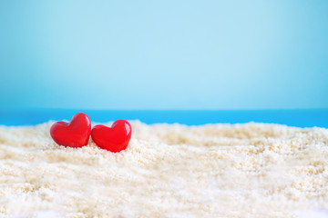red Heart shape on white sand beach ,Image For Love Valentine Day or summer vacation Concept.