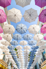 Colorful umbrellas as a shade decoration in a street in Abu Dhabi