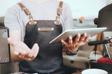 Successful small Asian business owner standing with working in cafe, lifestyle concept.