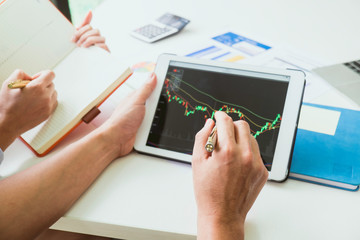 Asian business adviser meeting to analyze and discuss the situation on the financial report in the meeting room.Investment Consultant,Financial Consultant,Financial advisor and accounting concept