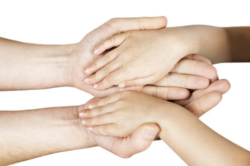 Little boy hands in dad's hands on light background, isolated hands. Concept of help and support in the family