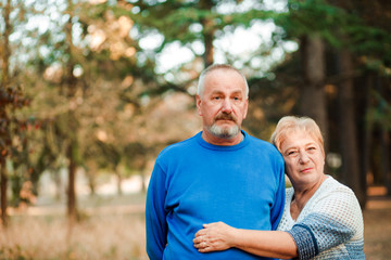 Pensioners walk in the park. Happy old age.