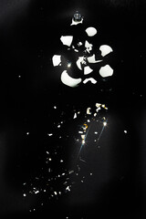 Obraz na płótnie Canvas Broken pieces of a christmas balls are sprea around a clen background,top view.