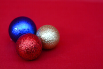 colorful christmas balls on red background