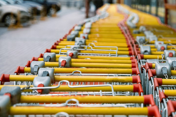 carts for purchase at the store. red food basket trolleys