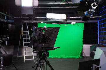 Modern video recording studio with professional equipment, focus on camera