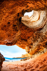 Rock formations on the shore of Atlantic ocean in Algarve, south Portugal. Fish eye lens effect