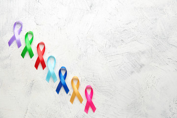 Different awareness ribbons on light background