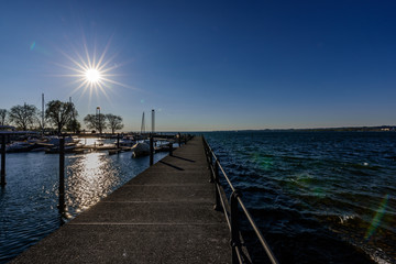 Lake Constance on a windy day with a sunstar