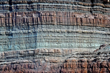 Sheer cliff of well bedded Mudstone/limestone and sandstones of the Cedar Mountain Formation,...