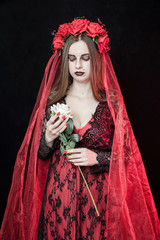 witch vampire girl in red dress with red veil - 303910601