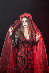 witch vampire girl in red dress with red veil - 303910872