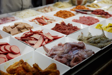 Assorted Chinese food set. Chinese noodles, fried rice, dumplings, peking duck, dim sum, spring rolls. Famous Chinese cuisine dishes on table. Top view. Chinese restaurant concept. Asian style banquet