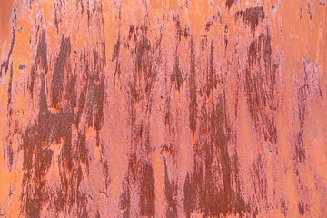 Rusty metal plate background texture covered with brown paint.