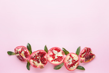 Ripe juicy pomegranates on color background