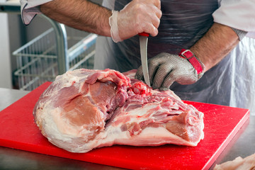 cutting meat in the meat shop