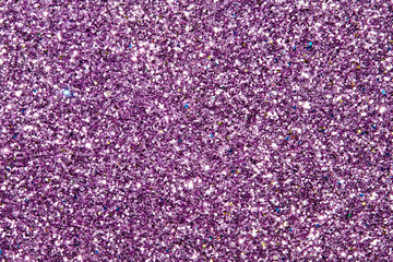 purple Sparkling Lights Festive background with texture. Abstract Christmas twinkled bright bokeh defocused and Falling stars. Winter Card or invitation	