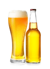 Bottle and glass of fresh beer on white background